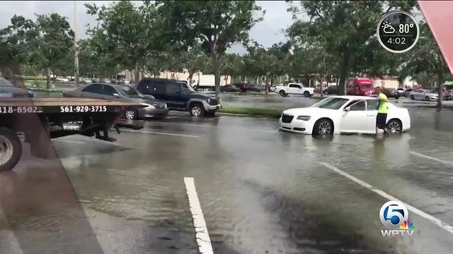 West Boca drenched by heavy rain, flooding parking lots