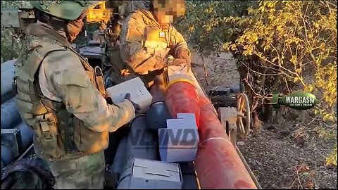 Loading surrender instruction flyers into the tip of a Russian rocket