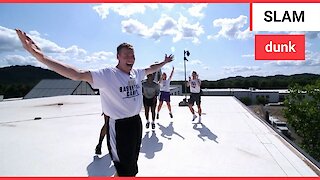 Incredible moment basketball coach lands 100ft trick shot from top of three story building