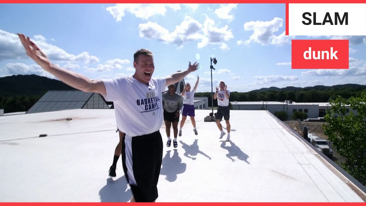 Incredible moment basketball coach lands 100ft trick shot from top of three story building