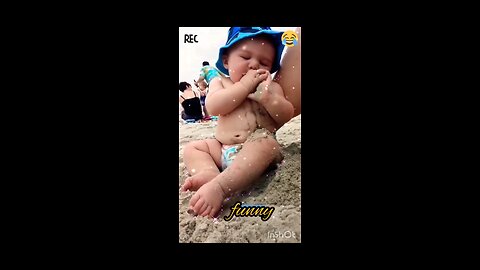 Funny baby reaction on the beach