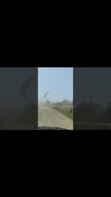 about 10 kids out waving to the army driving by the kids are smart and know who the good people are