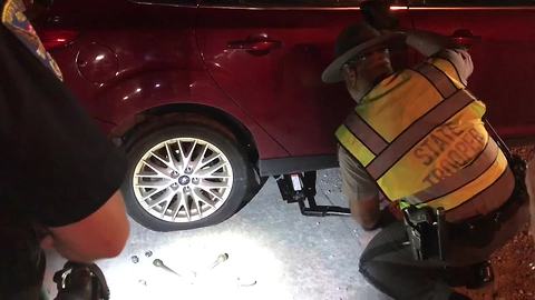 Police change 71-year-old woman's tire, help escort her home