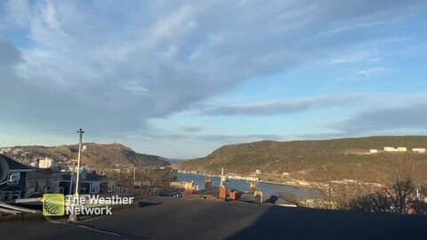 Wispy clouds sit over St. John's on a gusty day