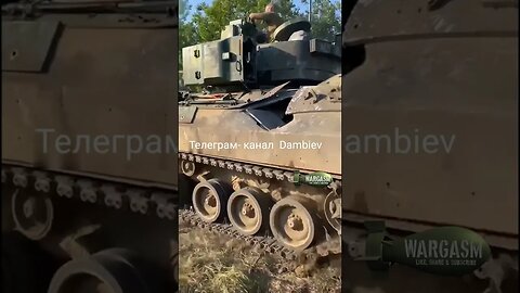 Bradley fighting vehicle with a hole after being hit by a tank shell