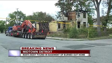 Man's body found in basement of burned out home