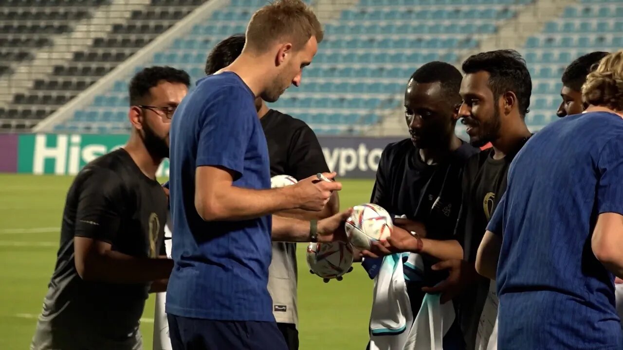 England squad welcome migrant workers to training camp in Qatar