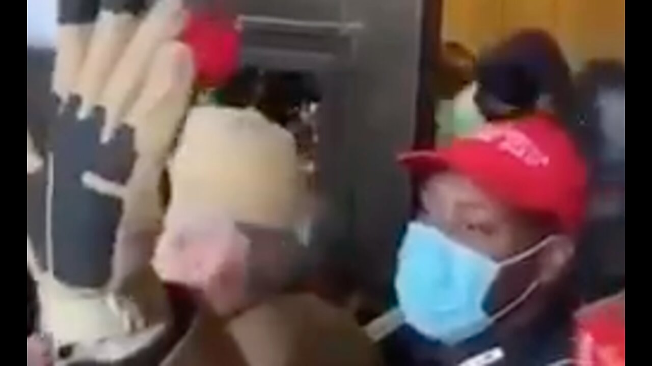 Notice how one of the Capitol Police officer tries to take the other police officers MAGA hat.