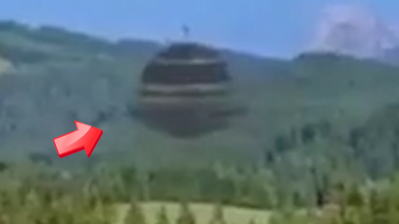 UFO shaped like a large bucket carrying a white object [Space]