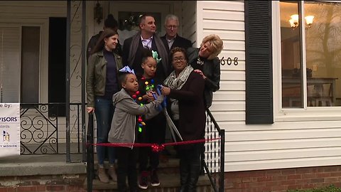 Community organizations come together to buy, renovate home for mom in need
