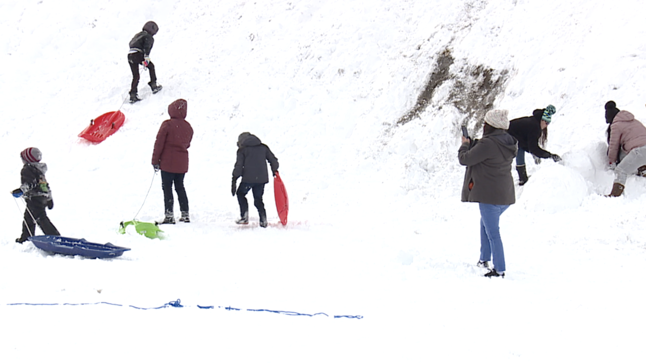 Families enjoy snowfall at Lee Canyon