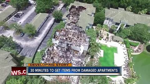 Demolition crews gather items from Allegro Palm apartments for fire victims