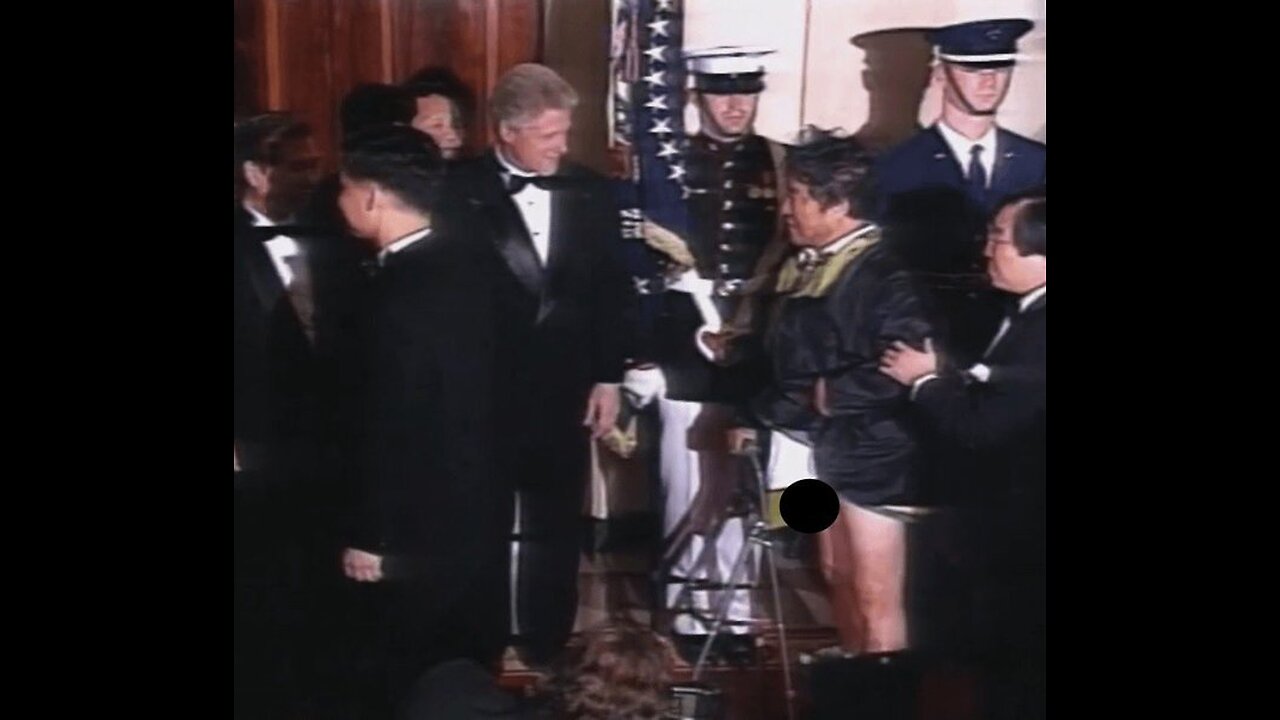 (June 9th 1998) South Korean Artist Nam June Paik meets President Bill Clinton. Wait for it @11s.