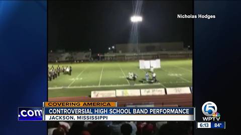 Band halftime show depicts police at gunpoint, stirs anger