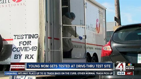 Young mom gets tested at drive-thru COVID-19 test site