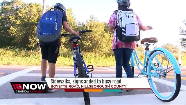 Sidewalks, signs added to busy Boyette Road