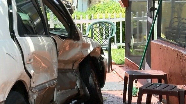 Car hits house after man shot in head