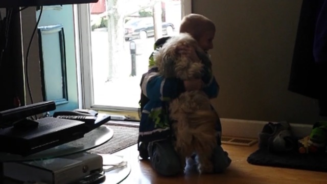 A Boy Falls To The Floor When He Finds His Missing Dog