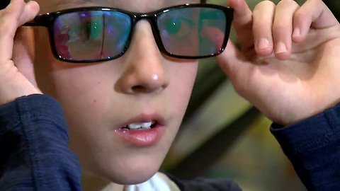 The moment a Colorado boy with color blindness sees color for the first time thanks to his friends