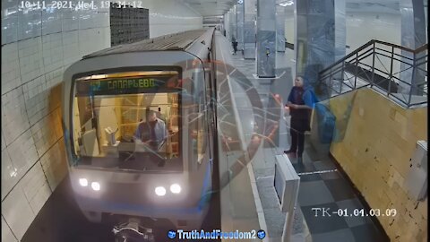 An invisible force pushes a man under the train?