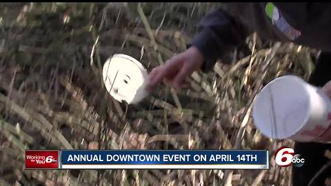 Dozens of people clean up trash along the White River