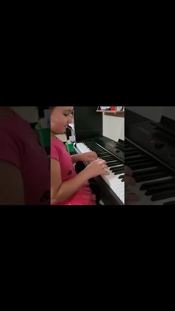 8 year old filipino-american girl playing the piano as a pipe organ as she plays, "Oh Holy Night."