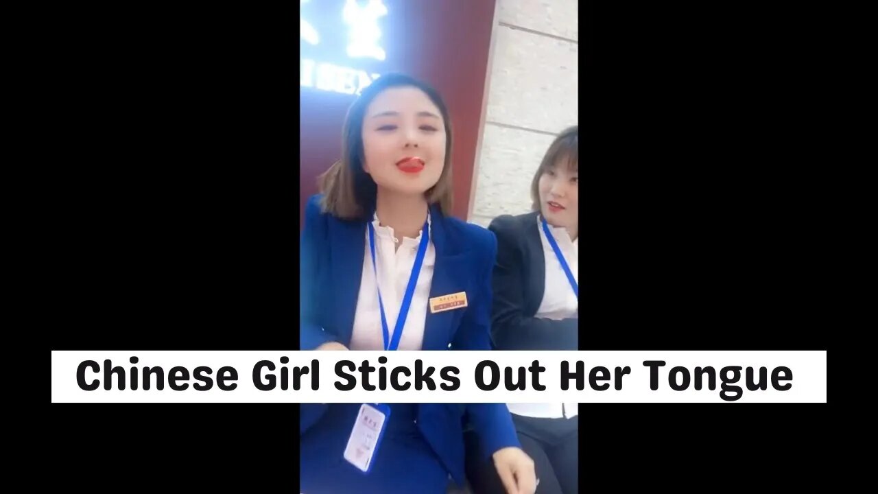 Chinese Girl Sticks Out Her Tongue