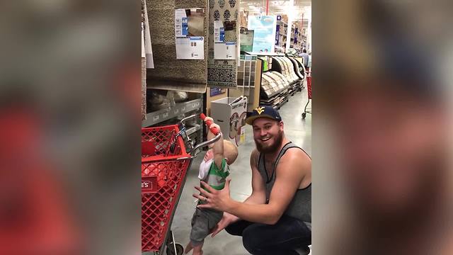 Guy In Supermarket Has A Great Fun With His Baby