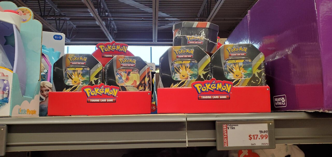 ALDI HAS POKEMON CARD TINS!! AND AT A DISCOUNT!! WHAT DID WE PULL??