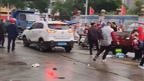 Driver Barrels Through School Children Outside Elementary School In China