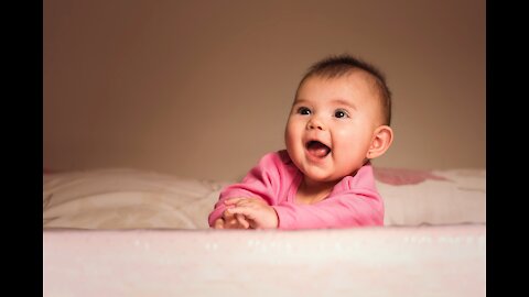 Baby laughing with