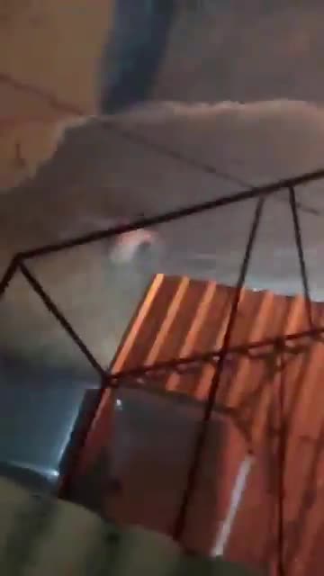 Dude gets dragged through torrential flood waters in Brazil