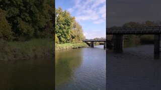 beautiful autumn river with bridge.