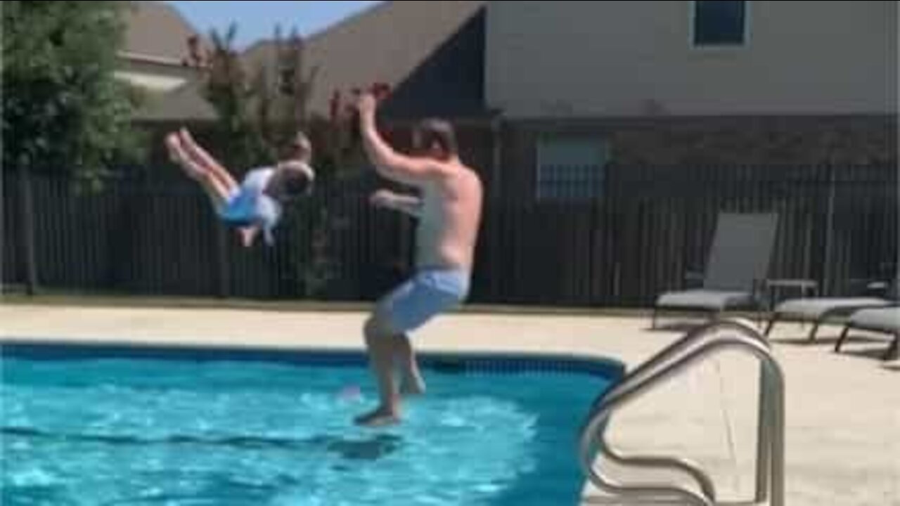 Dad throwing daughter into pool goes viral on the Internet!