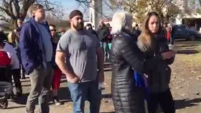 Families line up for fresh turkey at Maple Lawn Farms in Howard County