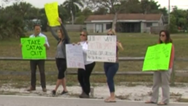 Parents protest outside Boca Raton Middle School over teacher behind Satanic display