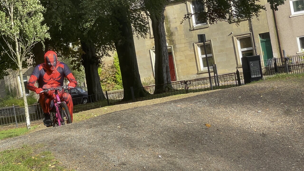 Deadpool rides kids bike