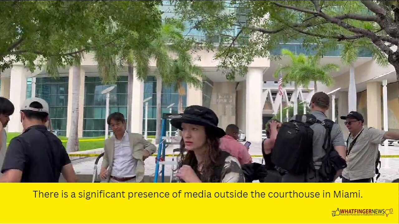 There is a significant presence of media outside the courthouse in Miami.