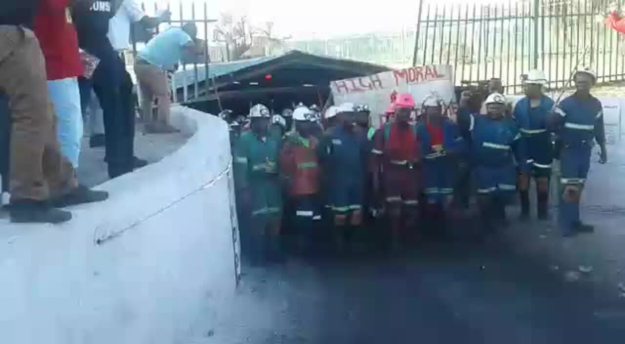 Jubilant workers emerge from underground after ending a nine-day sit-in at Rustenburg mine (Att)