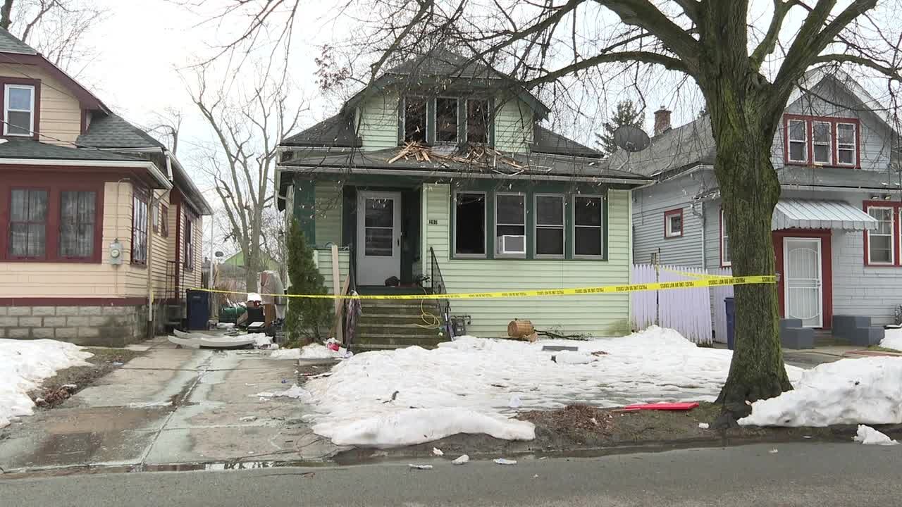 Community members working to help after a deadly house fire on Dartmouth Avenue