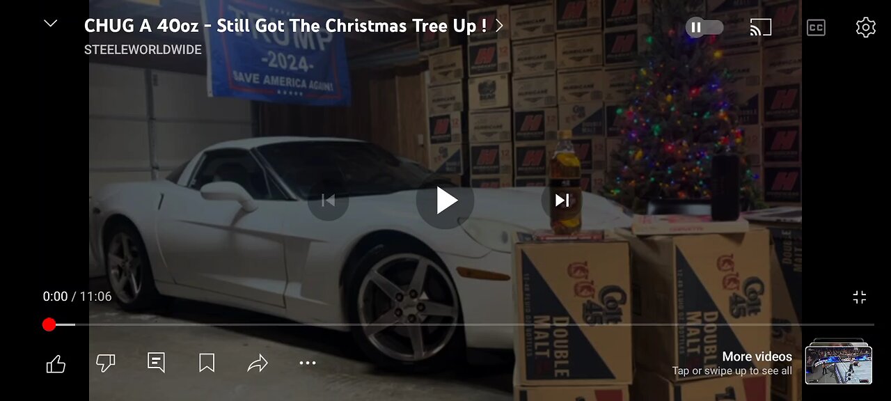 mask-man in the garage drinking a 40z (nice car)