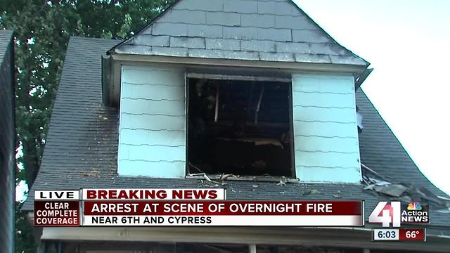 Police arrest man at scene of KCMO house fire