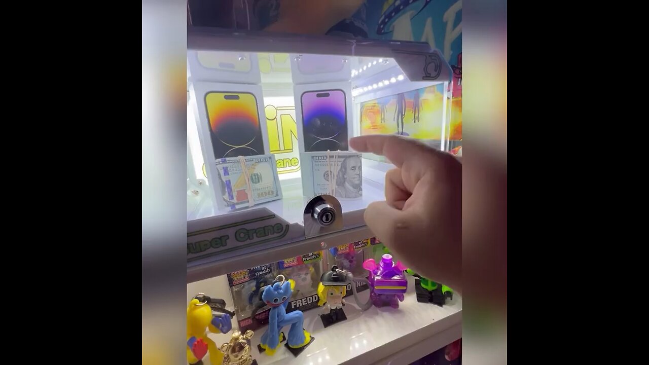 2 iPhone locked inside claw machine