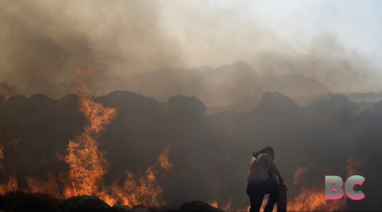 Wildfires in Greece prompt massive evacuations, leaving tourists in limbo