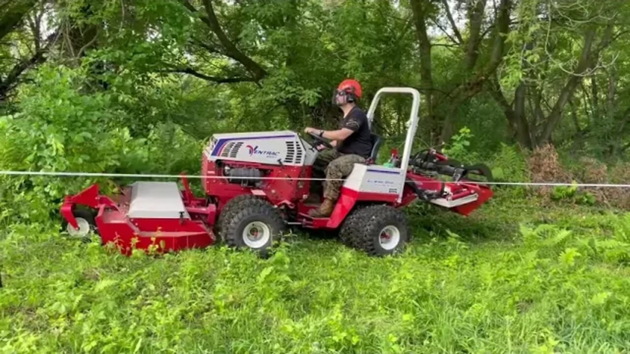 Diesel Ventrac 4500Y mowing along a fence with tough cut deck.