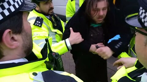male protester carried by arms and legs vaxuall bridge #metpolice