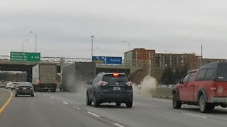 Driver maintains control as truck's tire blows out on highway