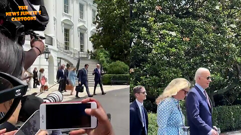 Biden shuffles by the press while surrounded by his handlers as a human shield.