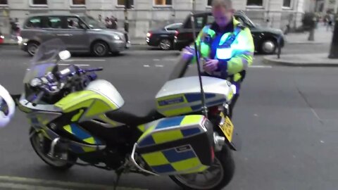 Police and ambulance help injured man