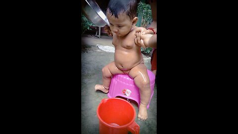 Cute baby taking bath